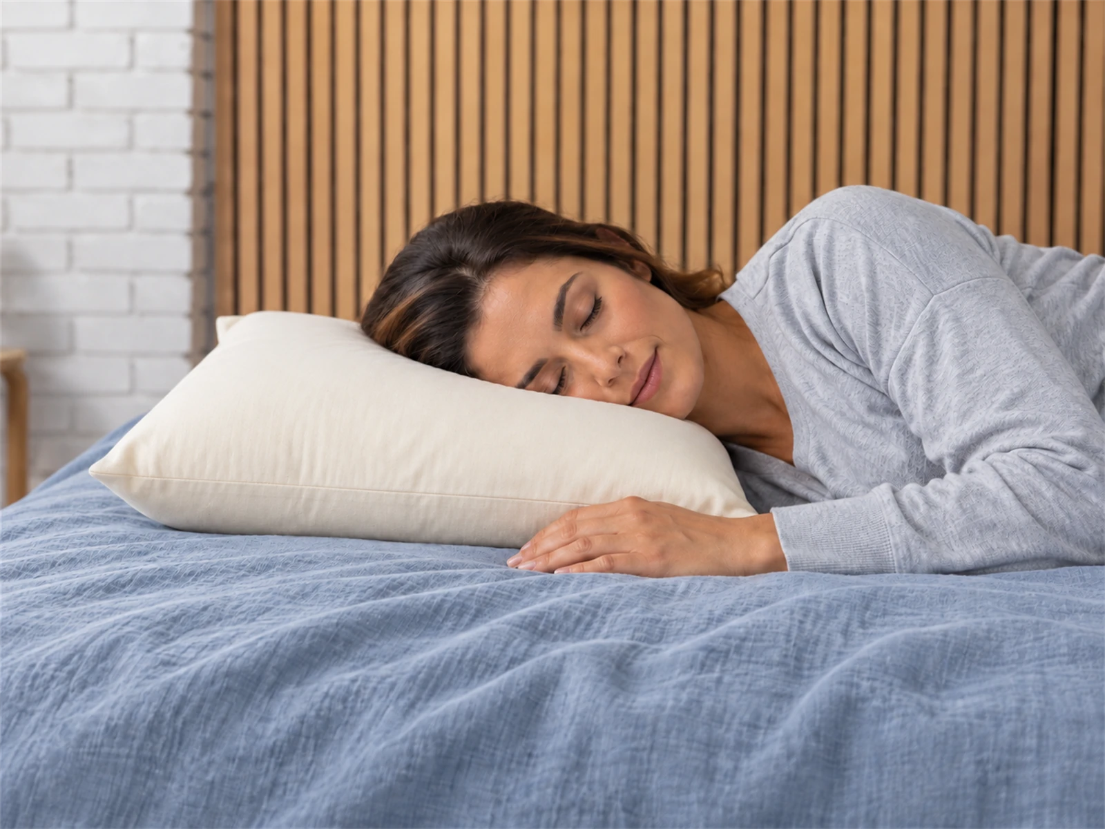 Sleep & Beyond myMerino Organic Wool Pillow: Woman resting on her side using the pillow