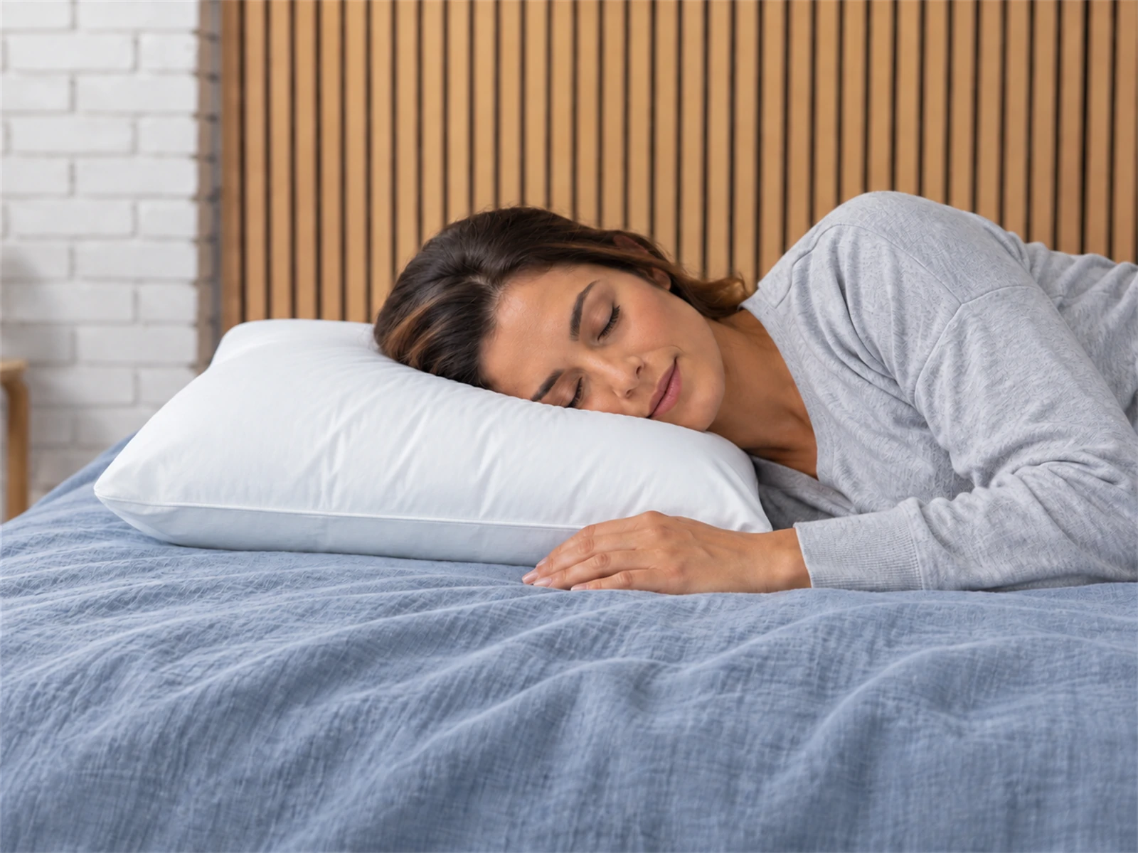 Sleep & Beyond myWool Washable Wool Pillow: Woman resting on her side using the pillow