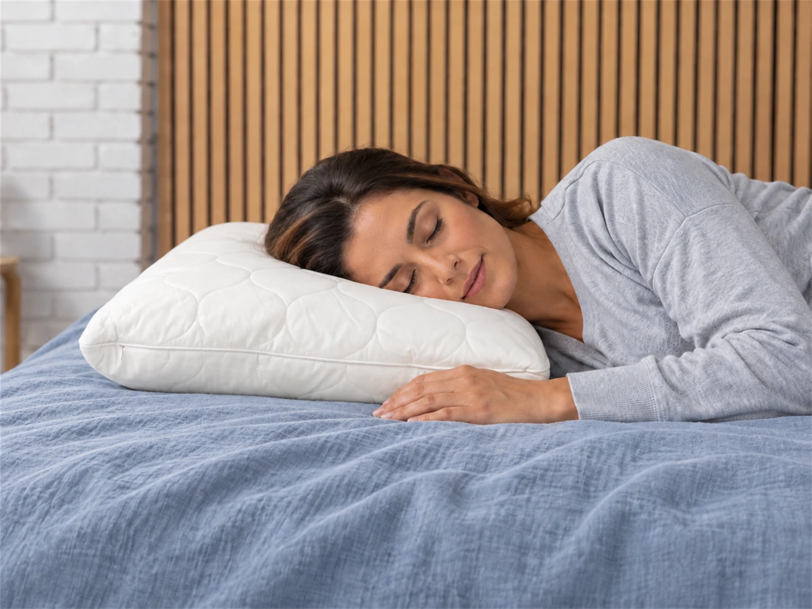Sleep & Beyond myWoolly Adjustable Wool Pillow: Woman resting on her side using the pillow