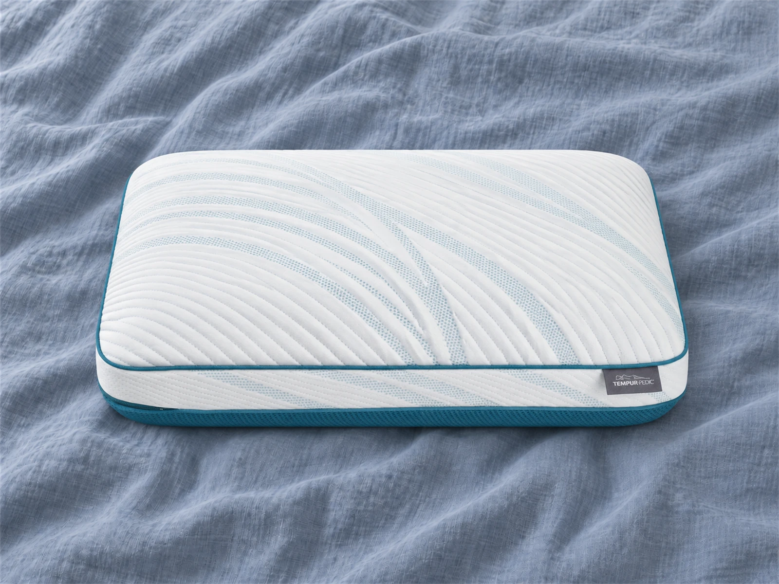Tempur-Pedic TEMPUR-Adapt Pro + Cooling Pillow: Front view on blue-gray linen