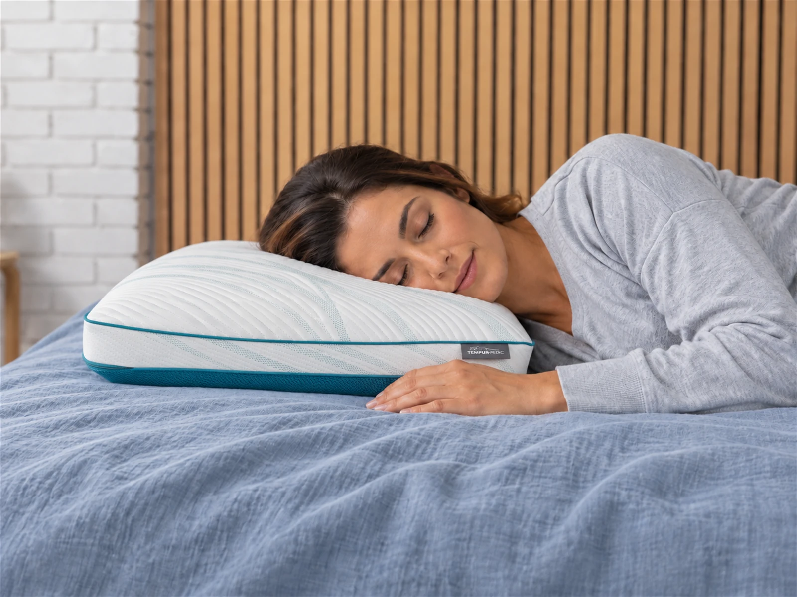 Tempur-Pedic TEMPUR-Adapt Pro + Cooling Pillow: Woman resting on her side using the pillow