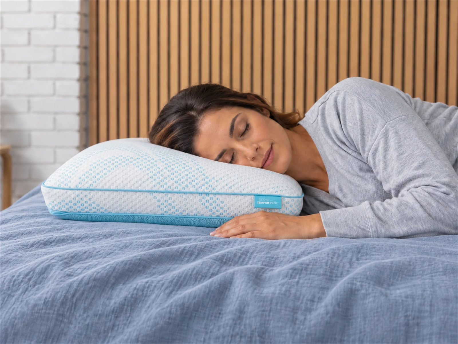 Tempur-Pedic TEMPUR-Breeze Pro + Advanced Cooling Pillow: Woman resting on her side using the pillow