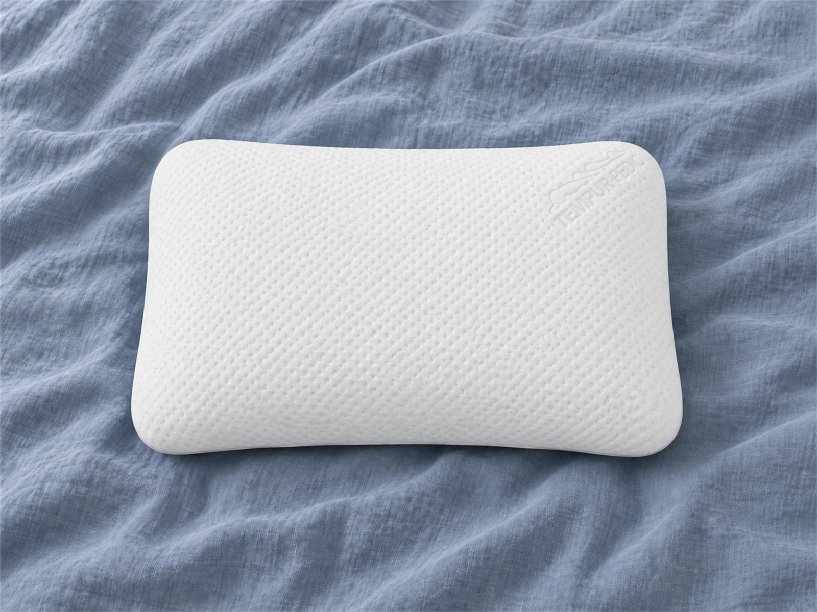 Tempur-Pedic TEMPUR-Symphony Pillow: Front view on blue-gray linen